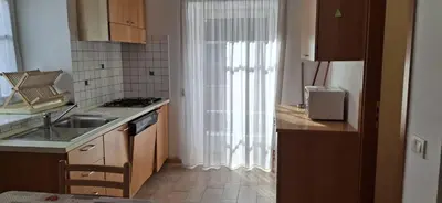 a small kitchen with a sink and a window at Chalet Decrestina in Campitello di Fassa