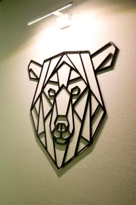 a wall decoration of a bear on a wall at Hotel Villa Argentina Ronzone in Ronzone