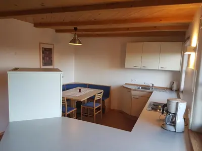 a kitchen and dining room with a table and chairs at Stofflhof in Proves