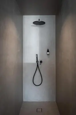 a bathroom with a shower in a wall at ADLER Historic Guesthouse in Bressanone