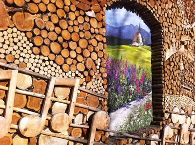 a wall with a painting of a field of flowers at Casa Lucia in Mezzano
