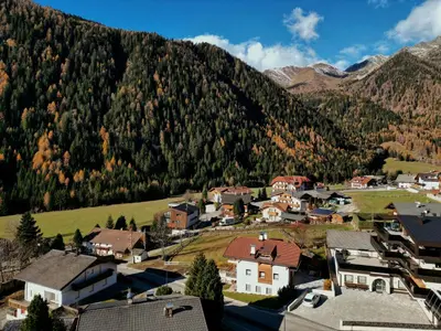 a town in front of a mountain at Appartamento Romantico a Valles in Valles