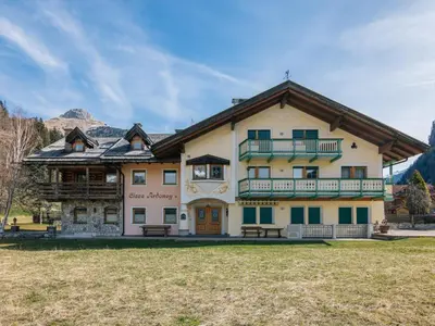 a large building with a balcony on the front at Apartment Ardoney-1 by Interhome in Campitello