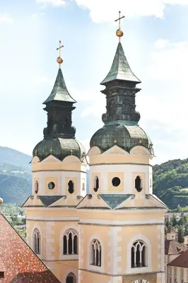 a church with two towers on top of a building at Residence Hotel Gasser in Bressanone