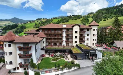 an aerial view of a hotel in the mountains at Almhof Hotel Call in San Vigilio Di Marebbe