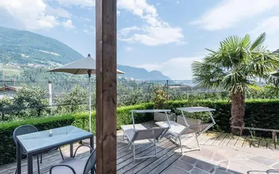 a window in a room with a view of a mountain at Hotel Zirmerhof & Residence in Rifiano