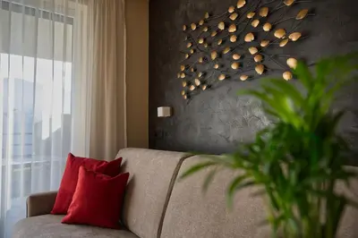 a living room with a tv on a wooden wall at Landhaus Freiburgerhof in Rifiano