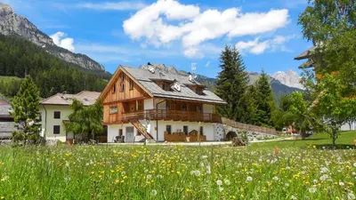 a house in the mountains with a field of flowers at Tobià el Salvan in Pera