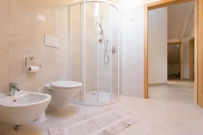 a bathroom with a shower and a toilet and a sink at Tobià el Salvan in Pera