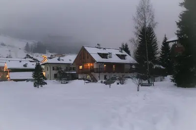 a house in the snow with lights on at Tobià el Salvan in Pera