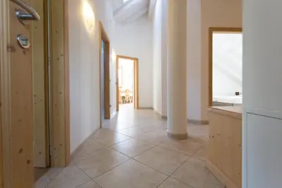 a hallway with white walls and a tile floor at Tobià el Salvan in Pera