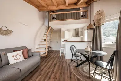a living room with a couch and a table at apartments55 in Bressanone