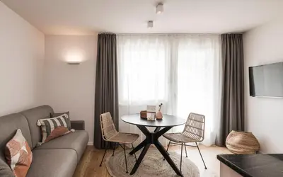 a living room with a table and a couch at apartments55 in Bressanone