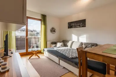 a bedroom with a couch and a table and a window at FaWa Apartments 