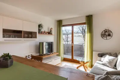 a living room with a couch and a tv at FaWa Apartments 
