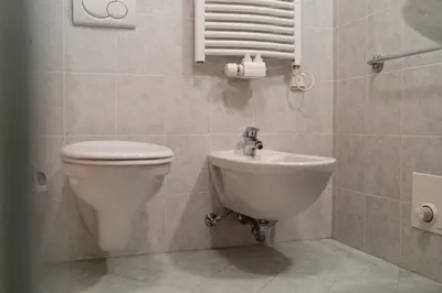 a bathroom with a toilet and a sink at FaWa Apartments 