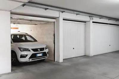 a car is parked inside of a garage at FaWa Apartments 