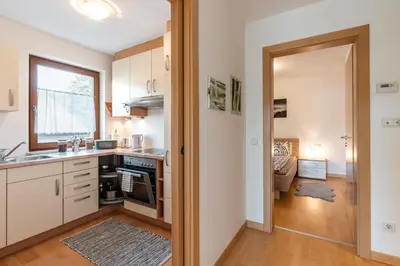 a kitchen with a sink and a stove top oven at FaWa Apartments 