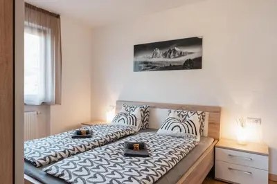 a bedroom with a bed with two candles on it at FaWa Apartments 