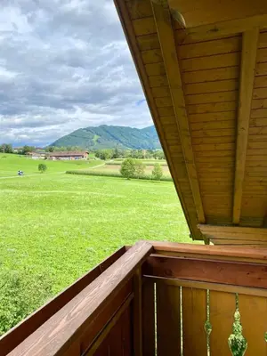 a porch with a view of a field of grass at Schönhuberhof Apartment Panoramablick in Brunico