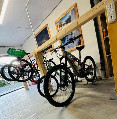two bikes parked on a rack in a room at Dolomitihouse AUNER in Fiera di Primiero