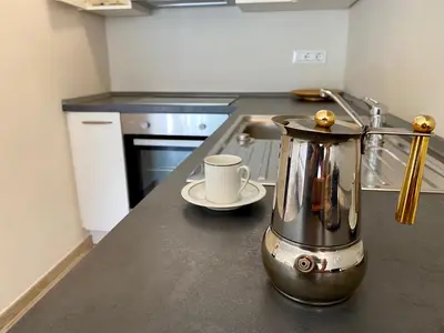 a blender sitting on a counter in a kitchen at Bright studio apartment with free private parking in Merano
