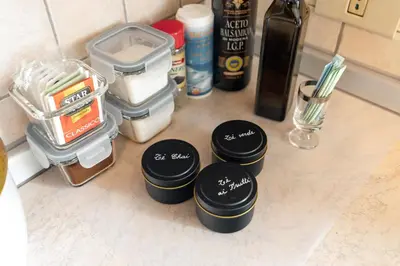 a group of containers sitting on top of a counter at Dolomitihouse AVET in Fiera di Primiero