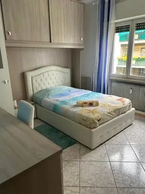 a bedroom with a bed and a window at Casa di Max - private room in apartment with shared bathroom FREE PARKING in Bolzano