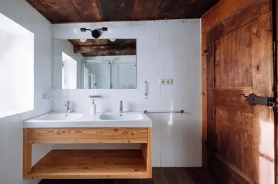 a bathroom with a sink and a mirror at Mountain house Ebner in Selva dei Molini