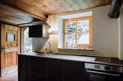 a kitchen with a sink and a window at Mountain house Ebner in Selva dei Molini