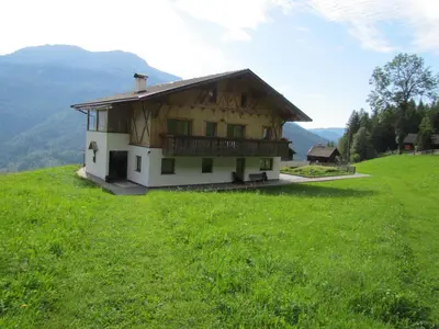 a house on top of a hill with a green field at Oeberst-hof in Sarntal