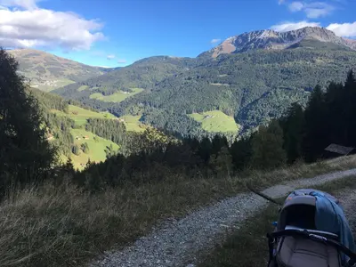 a backpack on the side of a mountain road at Oeberst-hof in Sarntal