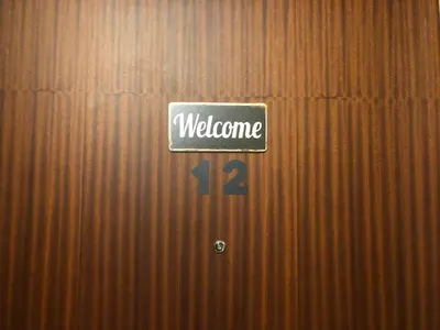 a sign that says welcome is on a wall at Guesthouse Gigli 2 - Free Tourist Card & car parking - no trucks in Bolzano