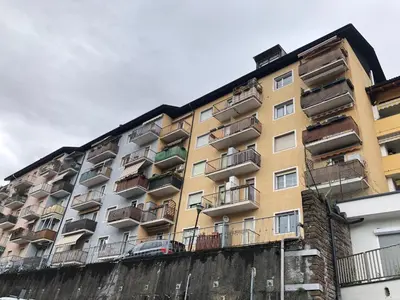 an apartment building with balconies on the side of it at Guesthouse Gigli 2 - Free Tourist Card & car parking - no trucks in Bolzano