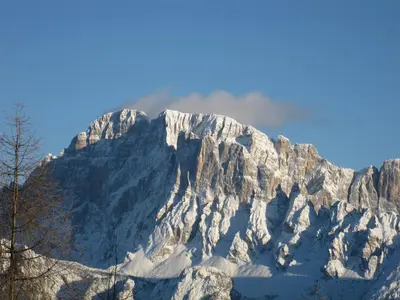 a mountain covered in snow on a clear day at Appartamento Alessia in Rocca Pietore