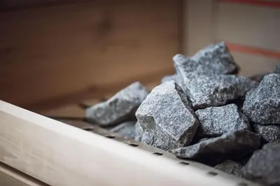 a pile of rocks sitting on top of a table at ROUDA luxury retreat am Kronplatz in Valdaora