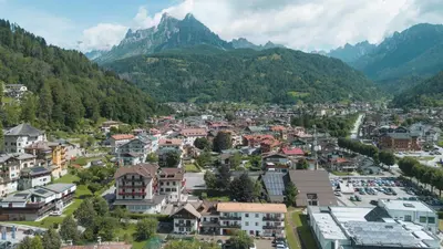 an aerial view of a town in the mountains at Dolomitihouse LARES in Fiera di Primiero