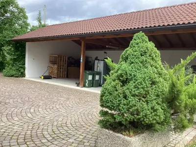 a christmas tree sitting in front of a house at Bbmarlene in Bolzano