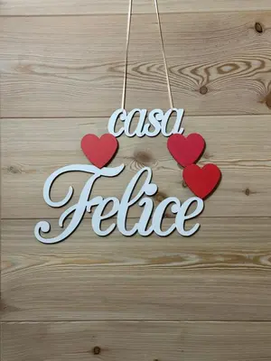 a sign that reads casa felicita with three hearts at Casa Felice in Caviola
