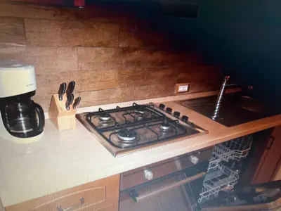 a kitchen counter with a stove top in a kitchen at Appartaments Sanderhof in La Valle