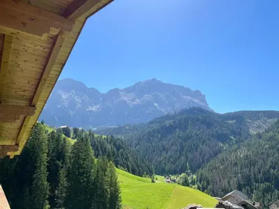 a view of a mountain range from a house at Appartaments Sanderhof in La Valle