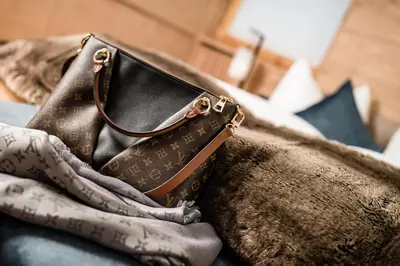 a brown purse sitting on top of a couch at Apartments Belaval in Santa Cristina in Val Gardena