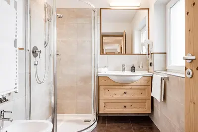 a bathroom with a sink and a shower at Apartment Bellaria in Santa Cristina in Val Gardena