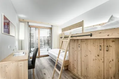 a bathroom with a sink and a toilet and a shower at Chalet Martina Apartments in San Vigilio Di Marebbe
