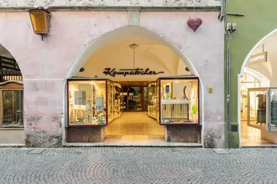 a store front of a building with an archway at Lauben Apartment Bolzano in Bolzano