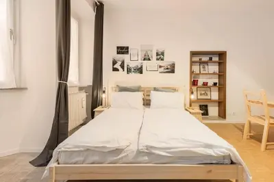 a bedroom with a large bed in a room at Lauben Apartment Bolzano in Bolzano
