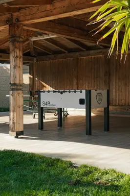 a ping pong table sitting under a pavilion at Oberwirtshof in Rifiano