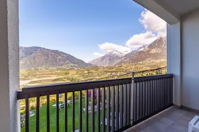 a balcony with a view of mountains at Hotel Tyrol in Schenna