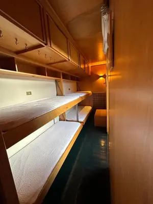 a row of bunk beds in a room at Harmony Apartment 31 in San Martino di Castrozza
