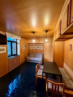 a living room with a couch and a table at Harmony Apartment 31 in San Martino di Castrozza